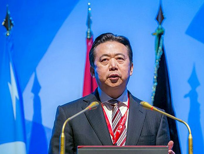 expresidente chino de Interpol, condenado a más de 13 años por corrupción